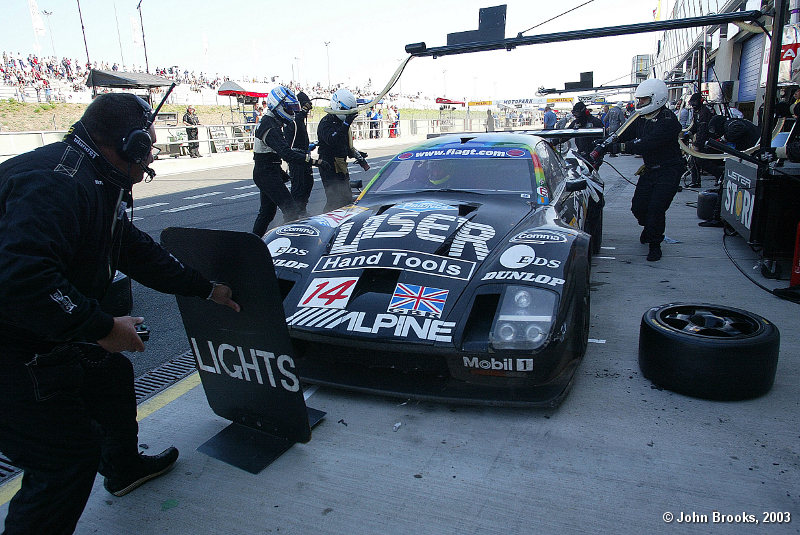 Laurence Pearce supervises the final Lister pit stop while in the lead..........a collision with the Alliot Viper lead to the exclusion of the Lister Storm