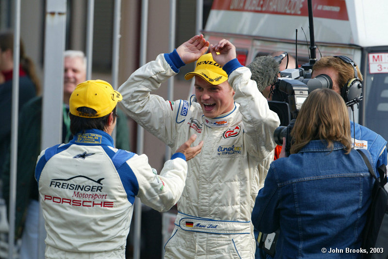 Marc Lieb and Stephane Ortelli celebrate the N-GT Championship win