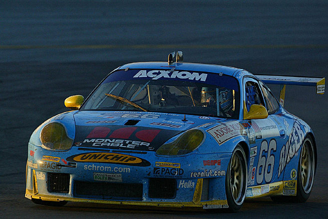 Kevin Buckler speeds through the dawn in his Racers Group Porsche on the way to victory in the 2003 Rolex 24